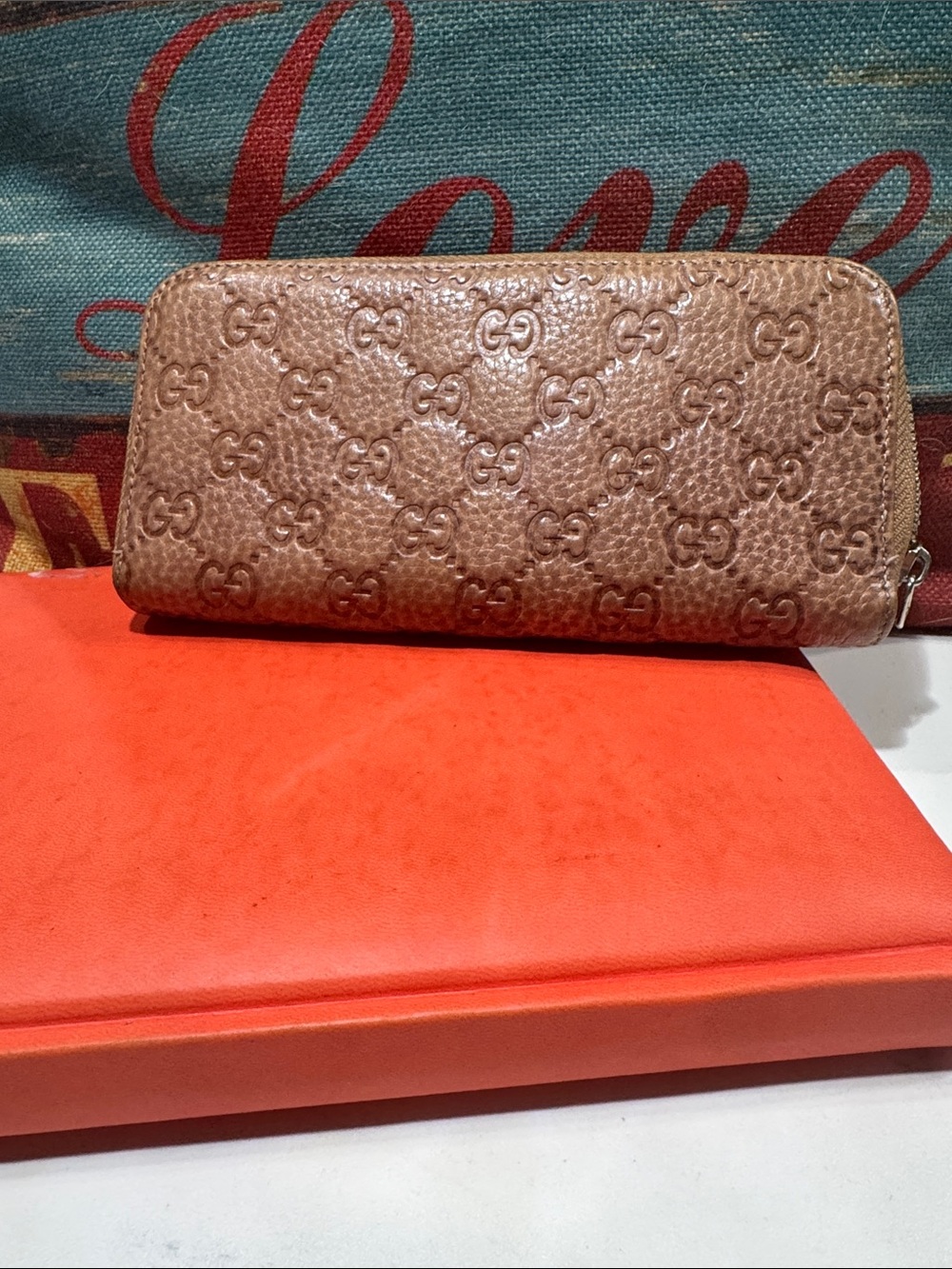 Gucci Brown Embossed GG Zip-Around Wallet